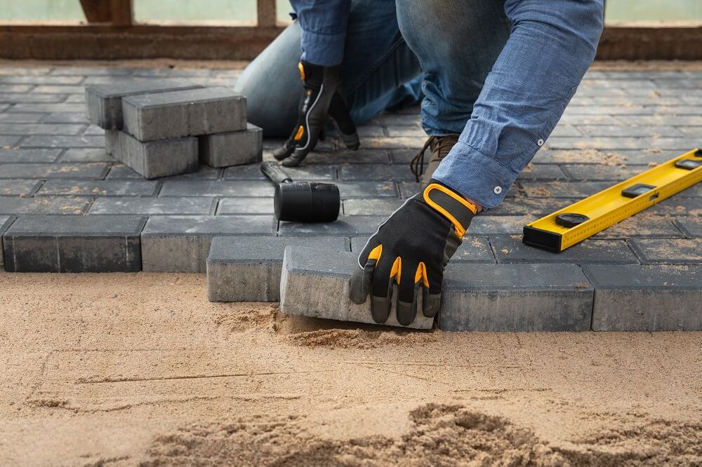 A Contractor Installing Pavers