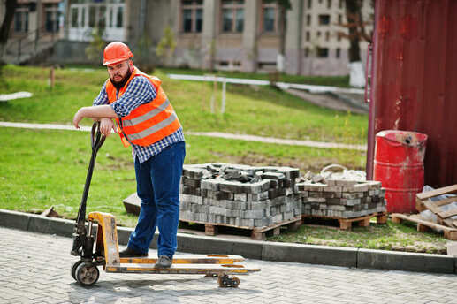Construction Worker Installing Paver